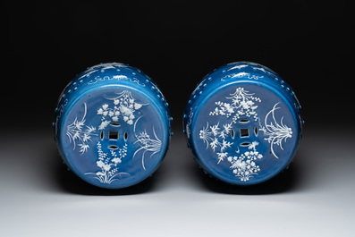 A pair of Chinese white slip-decorated blue-ground garden seats, 19th C.