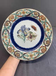 A pair of Chinese famille rose 'botanical' plates after Maria Sybilla Merian, Qianlong