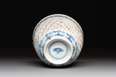 A Chinese blue and white reticulated double-walled cup and saucer, lingzhi mark, Kangxi