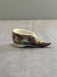 Two Chinese sancai-glazed shoes with flowers and butterflies design, Kangxi