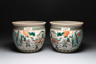 A pair of Chinese Nanking famille verte 'warriors' fish bowls, 19th C.