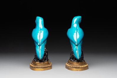 A pair of turquoise- and aubergine-glazed parrots with gilt bronze mounts, Kangxi