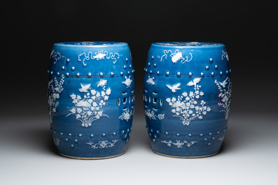 A pair of Chinese white slip-decorated blue-ground garden seats, 19th C.