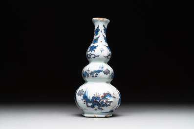 A Dutch Delft blue, white and manganese chinoiserie triple gourd vase, late 17th C.