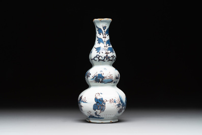 A Dutch Delft blue, white and manganese chinoiserie triple gourd vase, late 17th C.