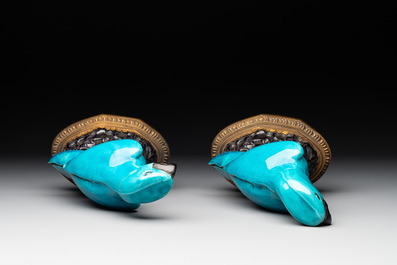 A pair of turquoise- and aubergine-glazed parrots with gilt bronze mounts, Kangxi