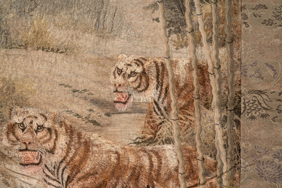 A Japanese embroidered silk wall tapestry with two tigers, Meiji, 19th C.