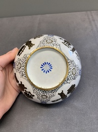 A pair of Chinese Canton enamel 'antiquities' bowls, Yongzheng/Qianlong