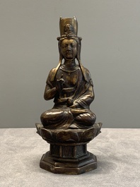 A Chinese bronze seated Guanyin on a lotus throne, probably Liao
