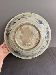 A Chinese Swatow blue and white dish with stylised floral design, Ming