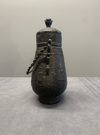 A Chinese archaistic bronze 'Taotie' wine vessel and cover, 'you 卣', Ming