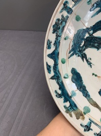 RETURNED 10/12/24 Two Chinese Swatow red-, turquoise- and black-enamelled 'phoenixes' and 'river landscape' dishes, Ming
