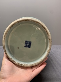 A Chinese slip-decorated celadon-glazed vase with floral design, Qianlong mark and of the period