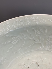 A rare Chinese Swatow slip-decorated pale-green-glazed 'dragon' dish, Ming