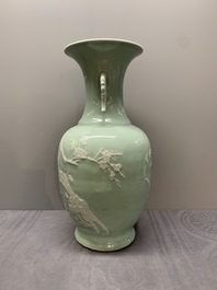 A Chinese slip-decorated celadon-glazed vase with floral design, Qianlong mark and of the period