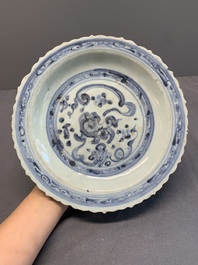 A Chinese blue and white 'phoenix' dish and two 'Buddhist lion' and 'peony' plates, Hongzhi/Zhengde