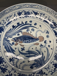 A large Chinese blue, white and copper-red 'carp' dish, 19/20th C.