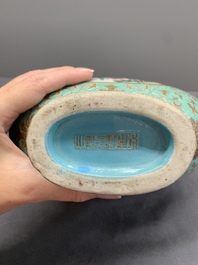 A Chinese gilt-decorated famille rose turquoise 'monkeys' and 'dogs' moon flask, Qianlong mark, 20th C.