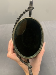 A Chinese archaistic bronze 'Taotie' wine vessel and cover, 'you 卣', Ming