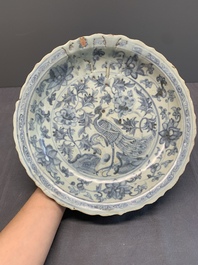 A Chinese blue and white 'phoenix' dish and two 'Buddhist lion' and 'peony' plates, Hongzhi/Zhengde