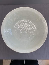 A rare Chinese Swatow slip-decorated pale-green-glazed 'dragon' dish, Ming