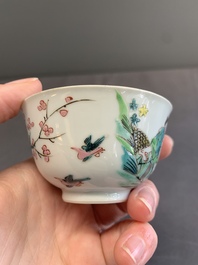A pair of Chinese famille rose 'beloved by the river' cups and saucers, Yongzheng