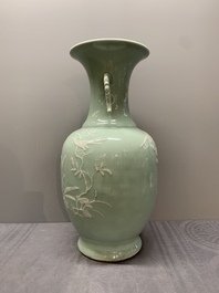 A Chinese slip-decorated celadon-glazed vase with floral design, Qianlong mark and of the period