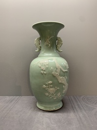 A Chinese slip-decorated celadon-glazed vase with floral design, Qianlong mark and of the period