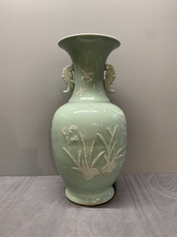 A Chinese slip-decorated celadon-glazed vase with floral design, Qianlong mark and of the period