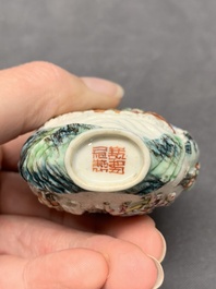A Chinese famille rose relief-molded snuff bottle with narrative design, Xianfeng mark and of the period