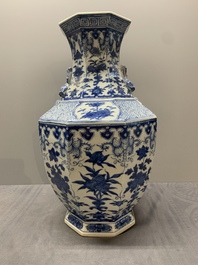 A pair of Chinese blue and white octagonal vases with floral design, 19th C.