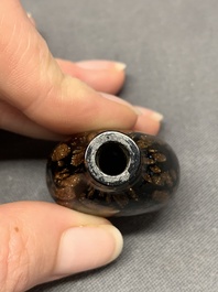 A Chinese aventurine-splashed black glass snuff bottle with a gilt stopper, 18/19th C.