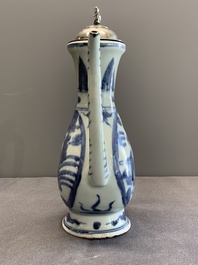 A Chinese silver-mounted blue and white ewer with figures in a landscape, Ming