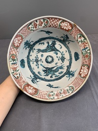 RETURNED 10/12/24 Two Chinese Swatow red-, turquoise- and black-enamelled 'phoenixes' and 'river landscape' dishes, Ming