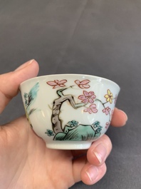 A pair of Chinese famille rose 'beloved by the river' cups and saucers, Yongzheng