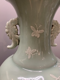 A Chinese slip-decorated celadon-glazed vase with floral design, Qianlong mark and of the period