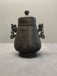 A Chinese archaistic bronze 'Taotie' wine vessel and cover, 'you 卣', Ming