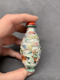 A Chinese famille rose relief-molded snuff bottle with narrative design, Xianfeng mark and of the period