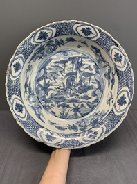 A Chinese Swatow blue and white dish with deer in a landscape, Ming