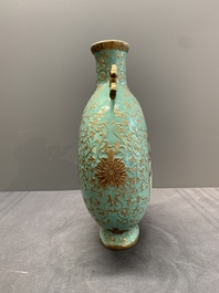 A Chinese gilt-decorated famille rose turquoise 'monkeys' and 'dogs' moon flask, Qianlong mark, 20th C.