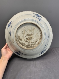 A Chinese Swatow blue and white dish with deer in a landscape, Ming