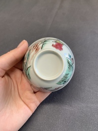 A pair of Chinese famille rose 'beloved by the river' cups and saucers, Yongzheng
