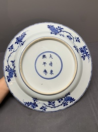 A Chinese blue and white 'four seasons' dish, Kangxi mark and of the period