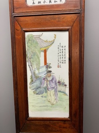 A Chinese carved wooden panel with famille rose Wang Qi 王琦-style plaques, dated 1932