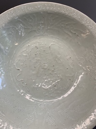 A rare Chinese Swatow slip-decorated pale-green-glazed 'dragon' dish, Ming