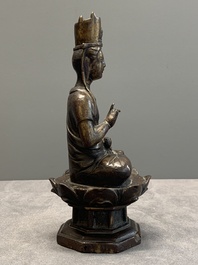 A Chinese bronze seated Guanyin on a lotus throne, probably Liao
