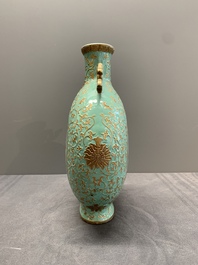 A Chinese gilt-decorated famille rose turquoise 'monkeys' and 'dogs' moon flask, Qianlong mark, 20th C.