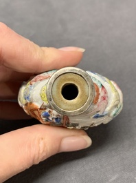 A Chinese famille rose relief-molded snuff bottle with narrative design, Xianfeng mark and of the period