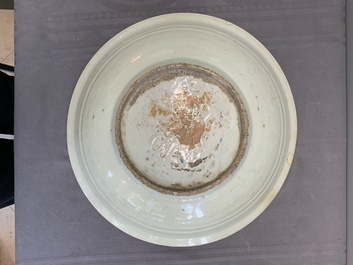 A rare Chinese Swatow slip-decorated pale-green-glazed 'dragon' dish, Ming