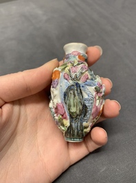 A Chinese molded famille rose 'playing boys' snuff bottle, Qianlong mark, 19th C.